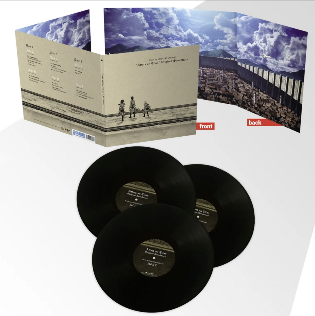 Attack on Titan season 1 vinyl spread, with an illustrative outside cover gatefold in a sepia tone that features the tracklist, and a full color inside of a sprawling city, wall, and blue sky. At the bottom of the image are the 3 black records fro the set spread out.
