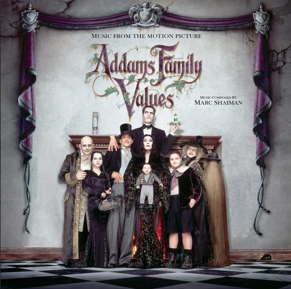 The album cover for 'Addams Family Values' music from the motion picture, featuring the cast of the movie in vintage clothing against a gothic-style backdrop with a fireplace and purple drapery.