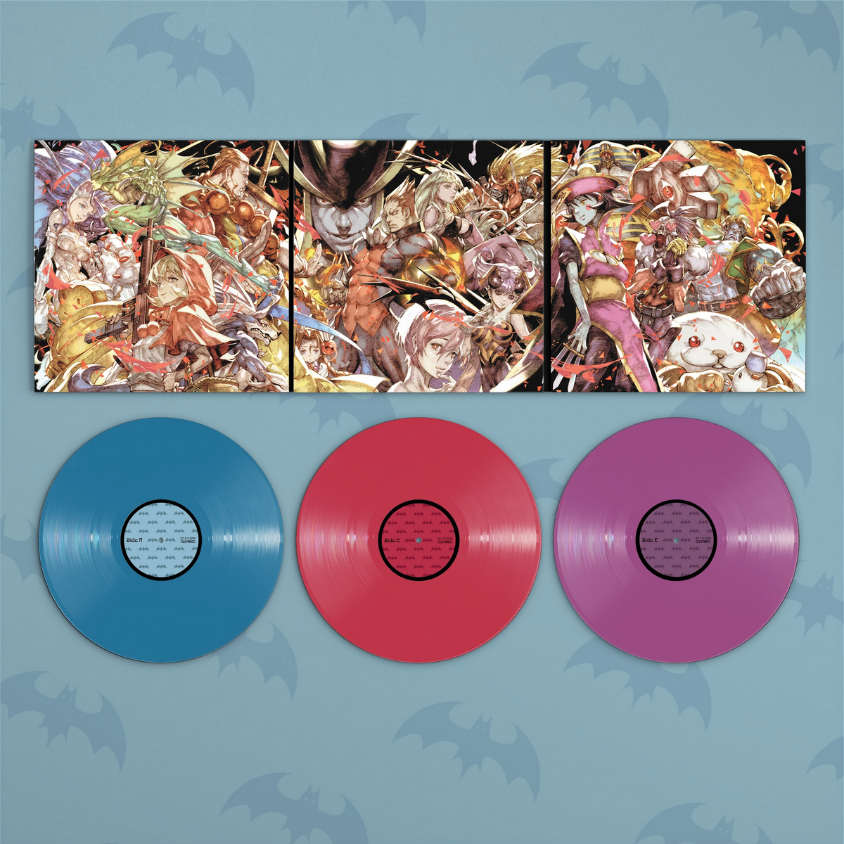 A vinyl record set featuring a three-panel trifold jacket with anime-style illustrated album cover above three colored records: blue, pink, and purple, on a light blue background with bat silhouettes.