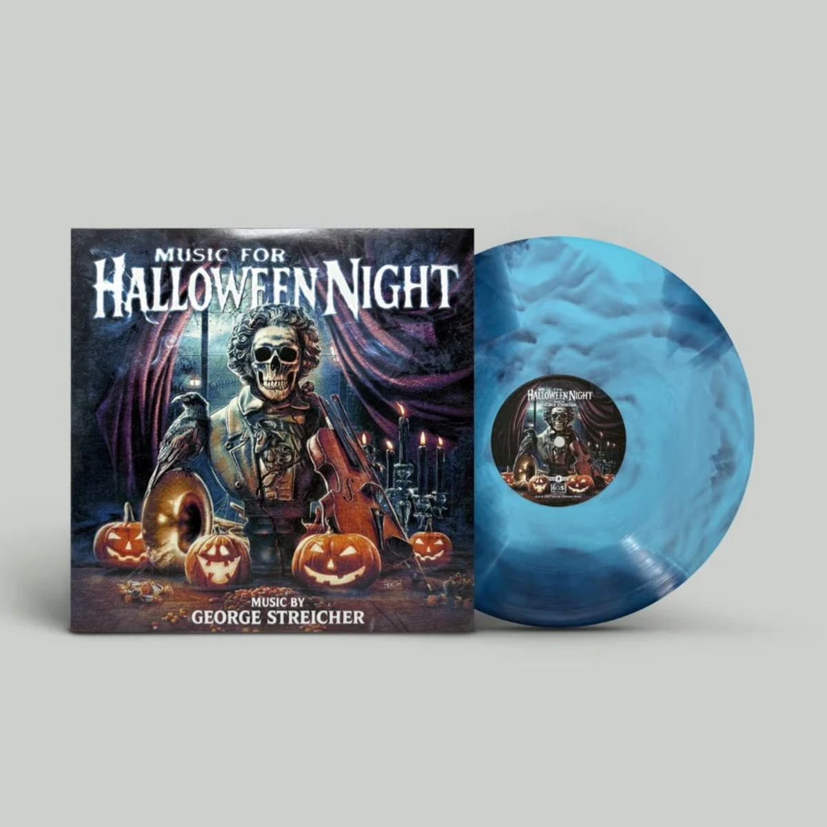 Front cover art featuring a bust wearing dapper vintage clothing that also has a skeleton face and puffed up curly hair. There's a french horn with a crow on it, a violin, then four jack o lanterns. The background is a spooky haunted mansion type setting. To the right side of the front cover is an example of the variant, which is a multi-blue smash variant.