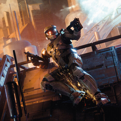 Master Chief dual wielding guns and sliding across a metal structure. There is a cityscape behind him.