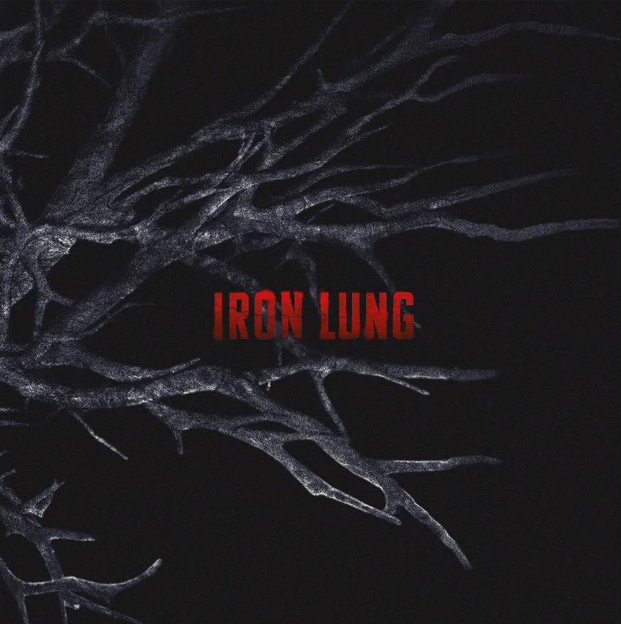 A dark graphic with the words "IRON LUNG" in red blocky lettering over a black background, overlaid with gray skeletal tree branches.