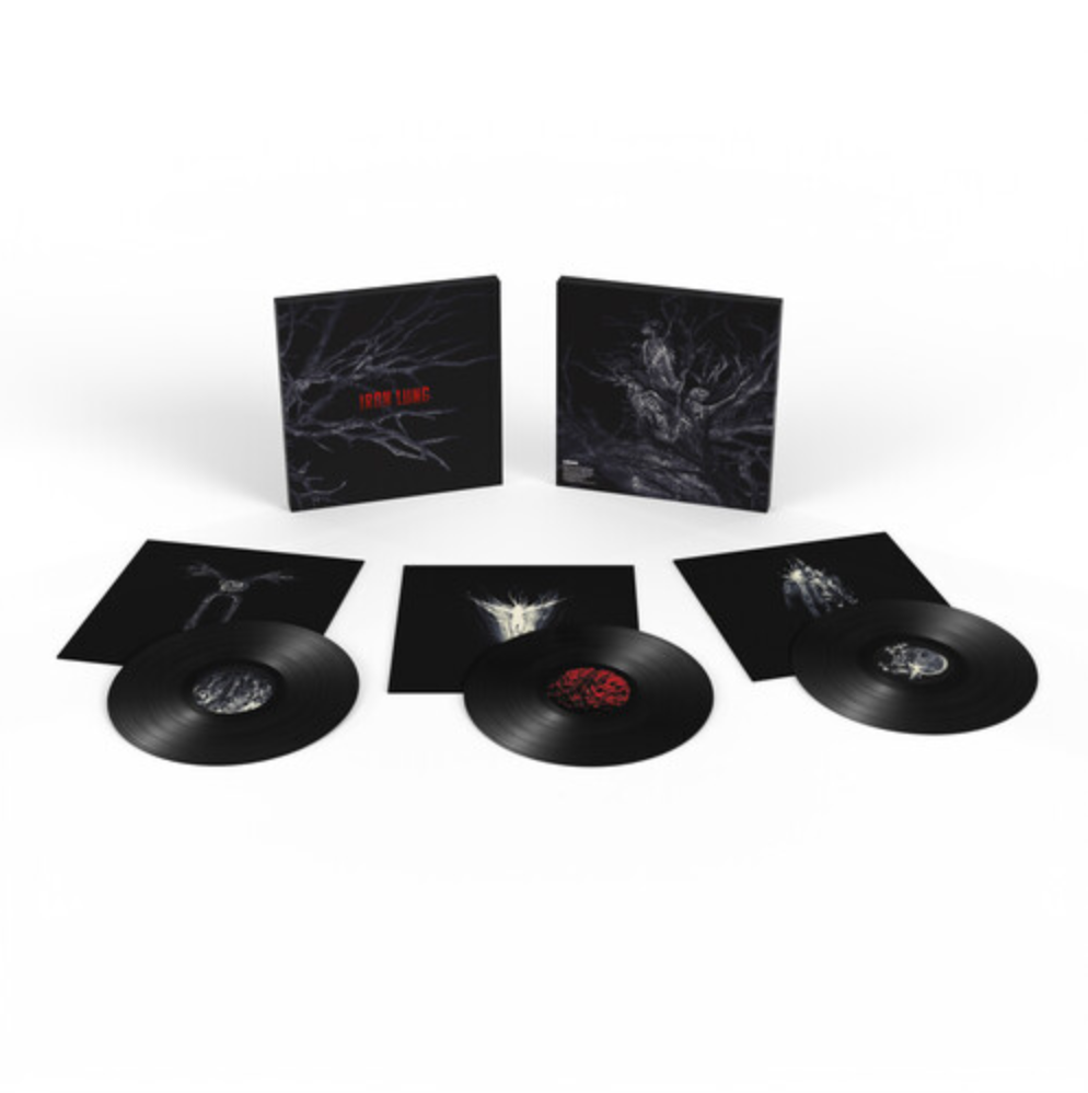 The full spread of the Iron Lung movie soundtrack on vinyl. The front and back of the box are on display with the three inner sleeve front sides below it, and the three discs on top of those. All the artwork displayed are x-ray photos in black and white with creepy organic and skeletal imagery. The only red on the packaging is the "Iron Lung" title and the second disc center label. All are shot on a white background.