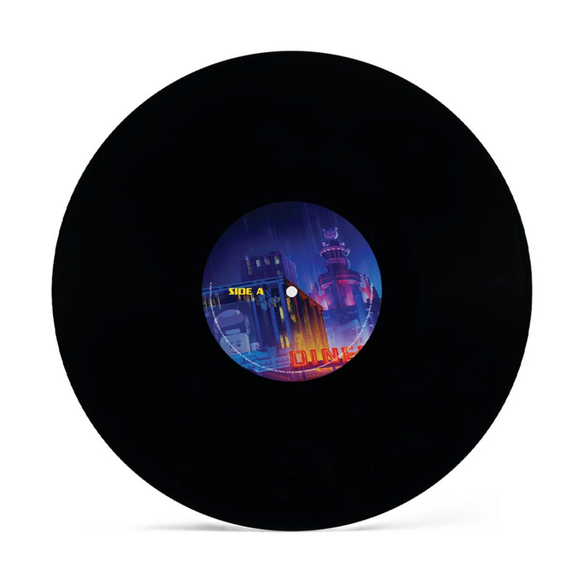 A black vinyl record for Lego Batman with a colorful cityscape-style center label featuring blue, purple, and orange tones, shown on a plain white background.