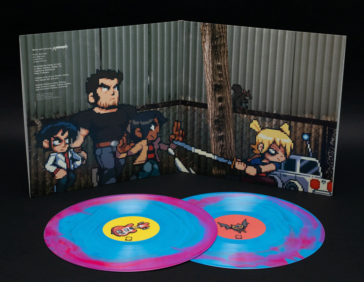 A vinyl record album shown open with two marbled blue and pink records in front. The gatefold cover art depicts pixel art characters in a dark outdoor scene with a real photograph.