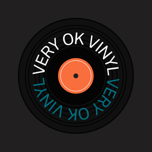 Vinyl record graphic spinning with an orange centre and the words "Very Ok Vinyl" on it in white and blue. 